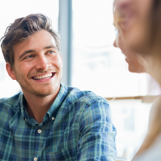 happy man smiling at a girl