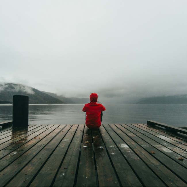 person sitting on deck alone