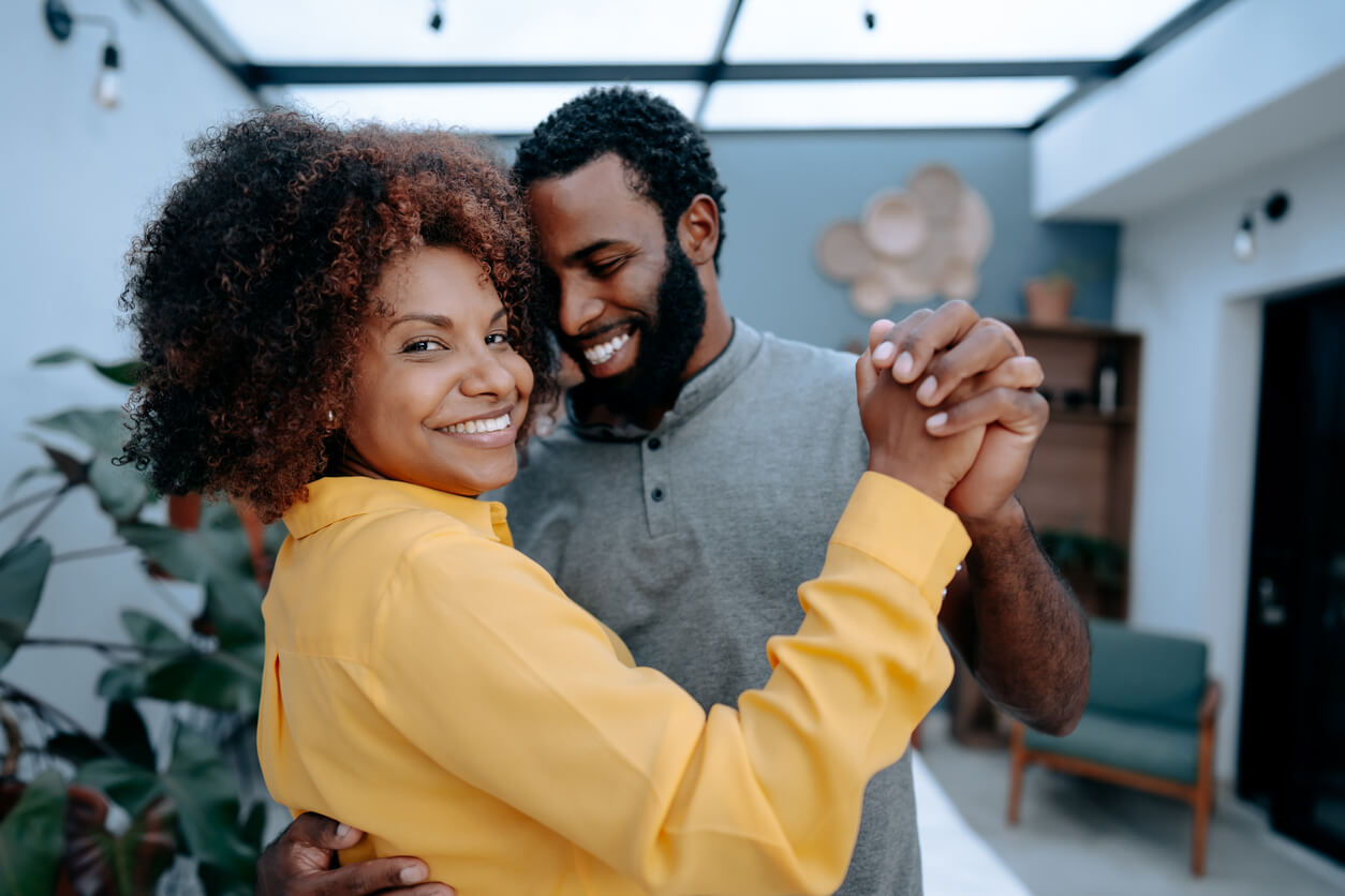 A happy couple dancing.