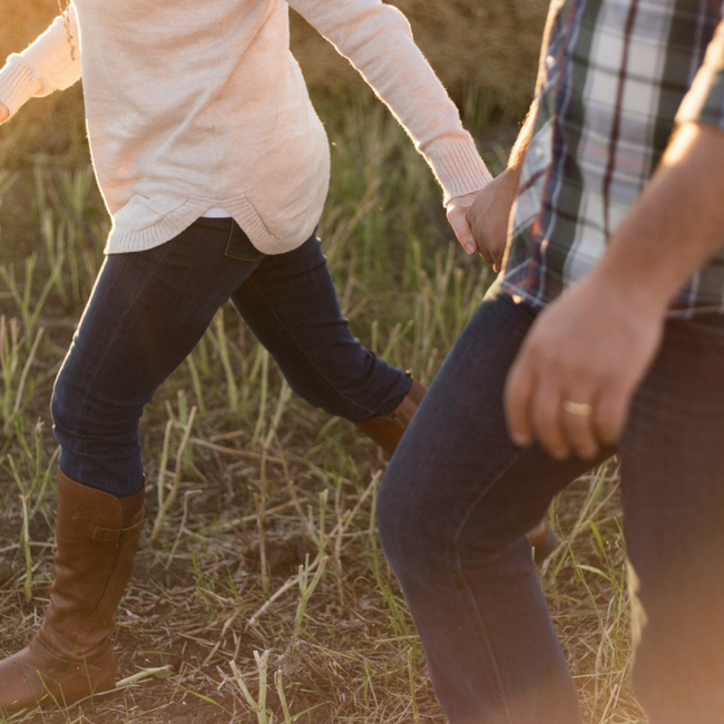 couple walking in field