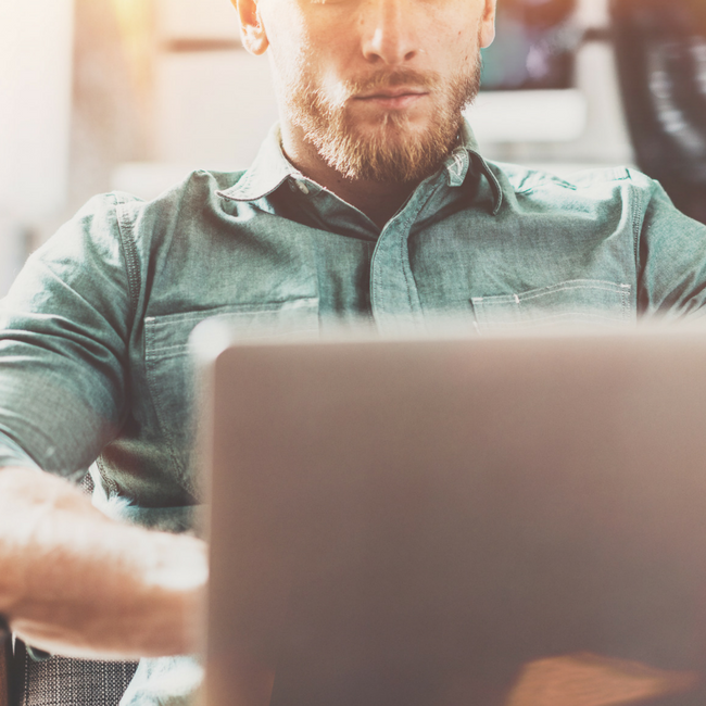 serious man on computer