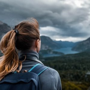 woman overlooking mountain river