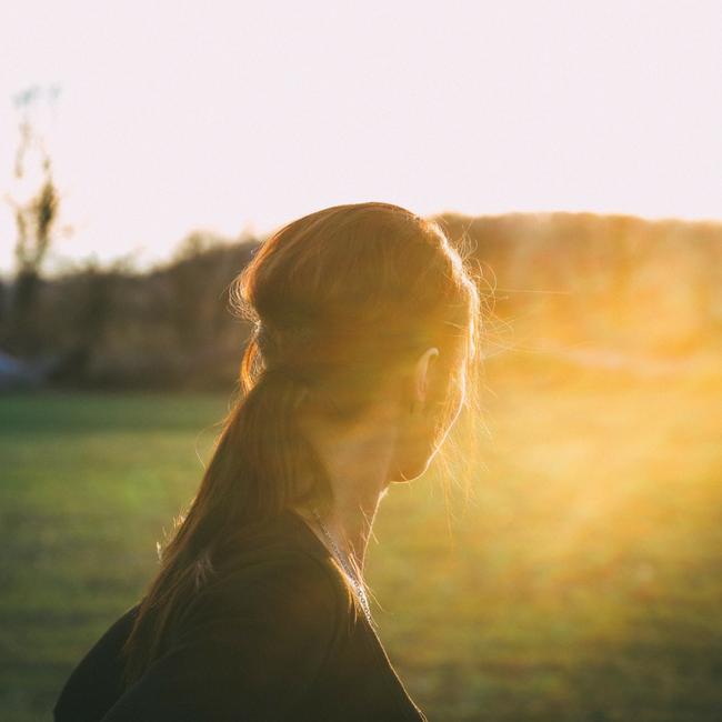 woman looking into a distant field