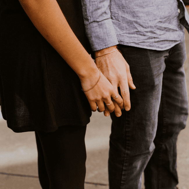 close up of couple holding hands