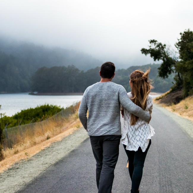 couple walking down road