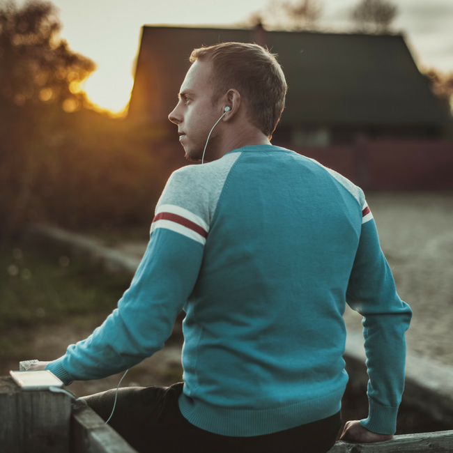 man watching sunset at a farm