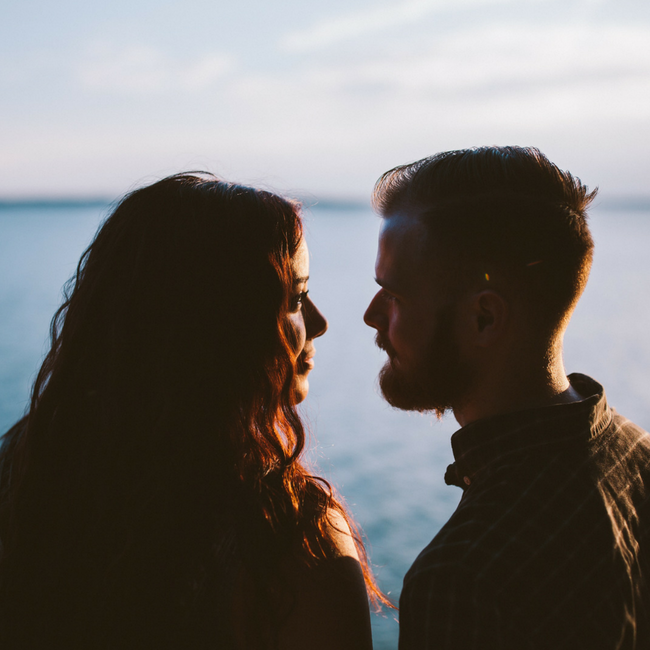 smiling couple by water