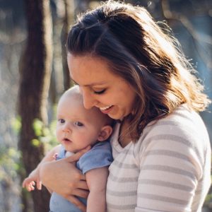 mom holding young baby