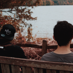 two friends sitting on bench