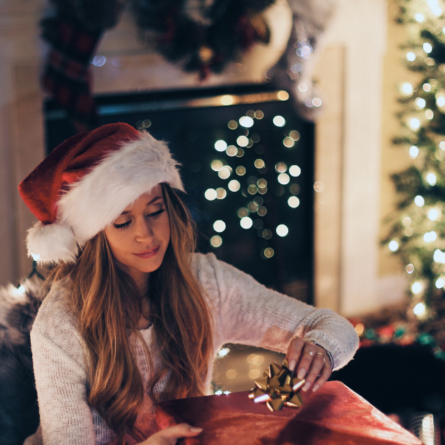 woman opening present by herself