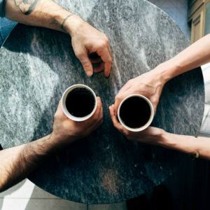 couple drinking coffee at table