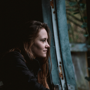 girl looking out window