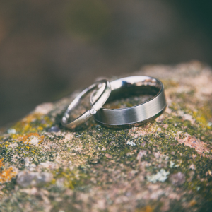 wedding rings sitting on rock