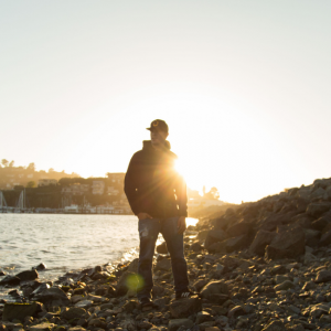 man looking over the water