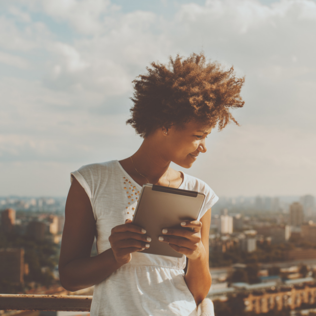 girl smiling with tablet