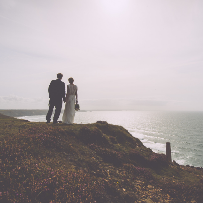 married couple overlooking cliff