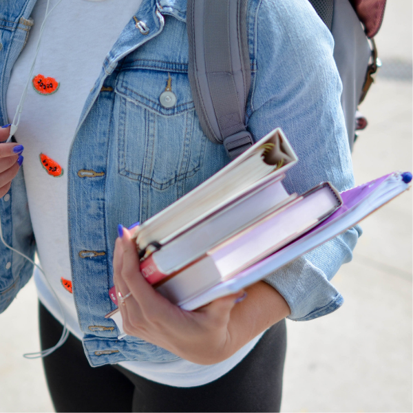 female student holding books