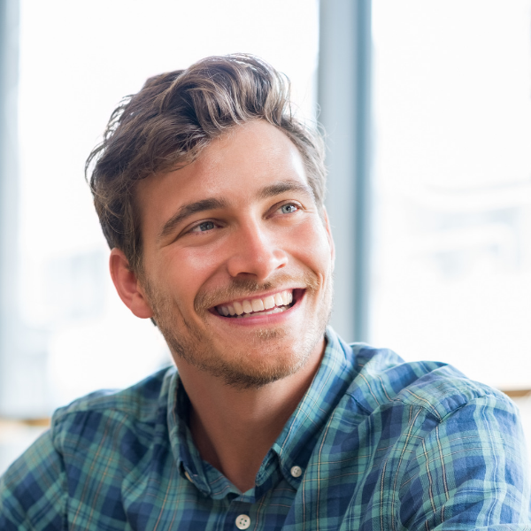 happy young man looking at friend