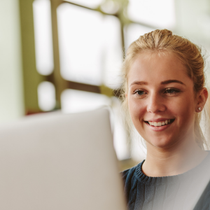 high school girl looking at computer