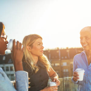 three woman talking outside