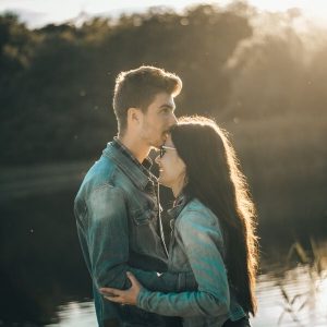 young couple by water