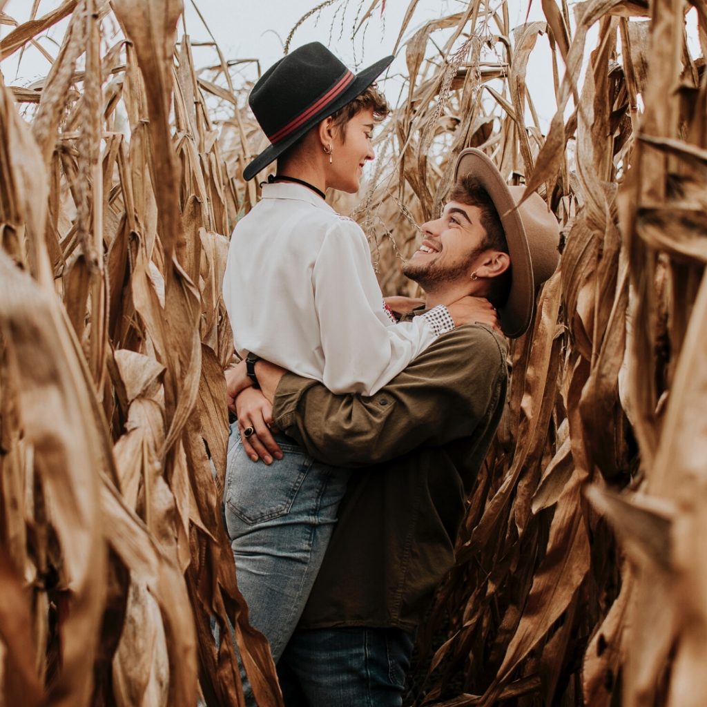 couple hugging in corn field