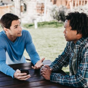 friends talking at picnic table