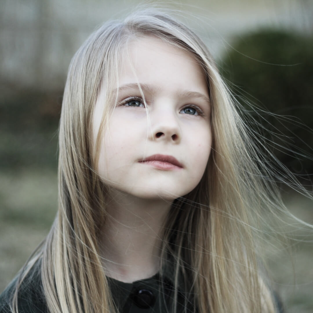 young girl looking up