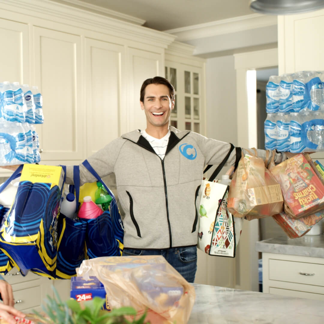 man holding all the grocery bags at once