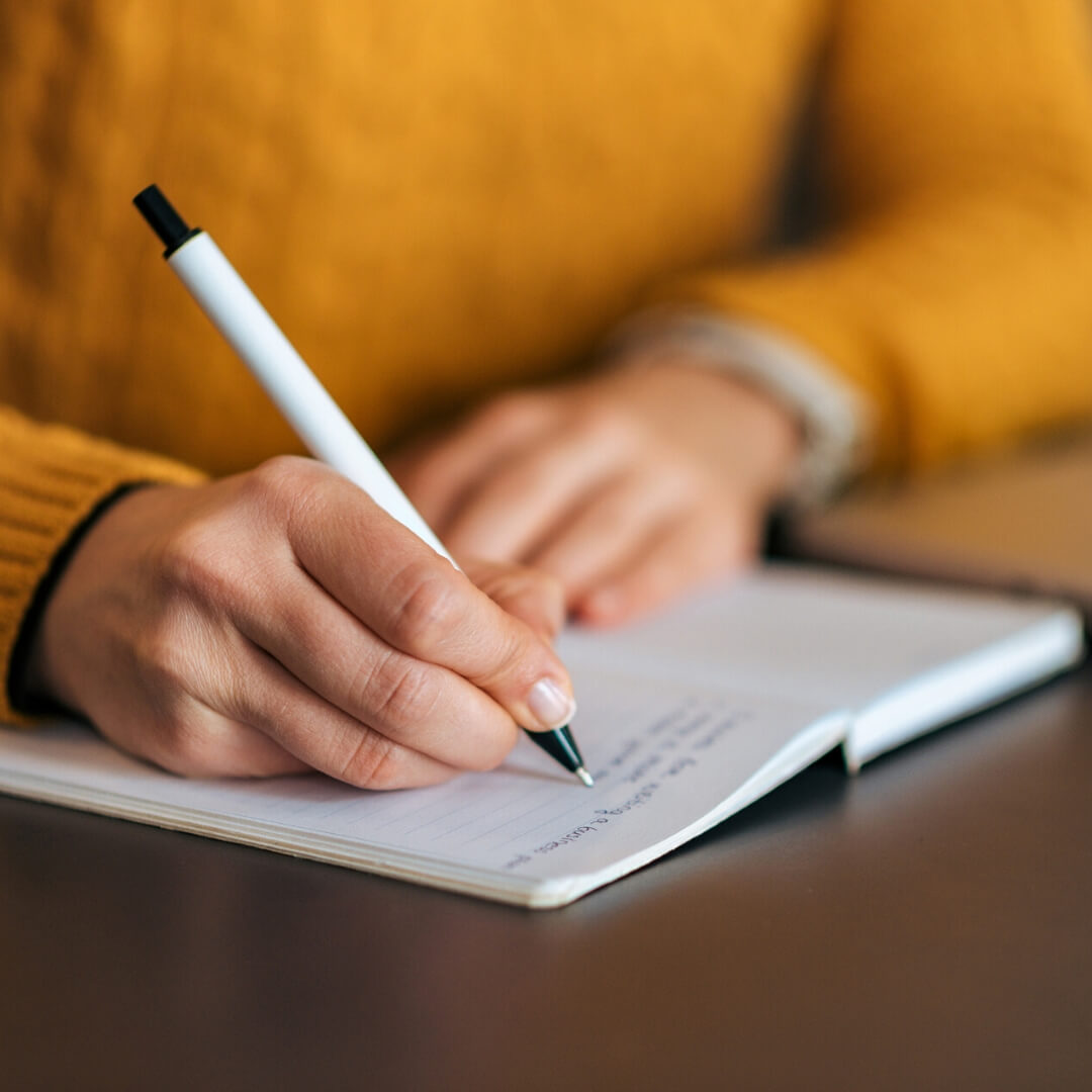 woman writing in journal