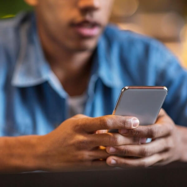 teen texting on phone