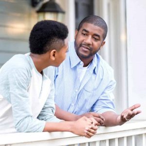 A father talks with his son.