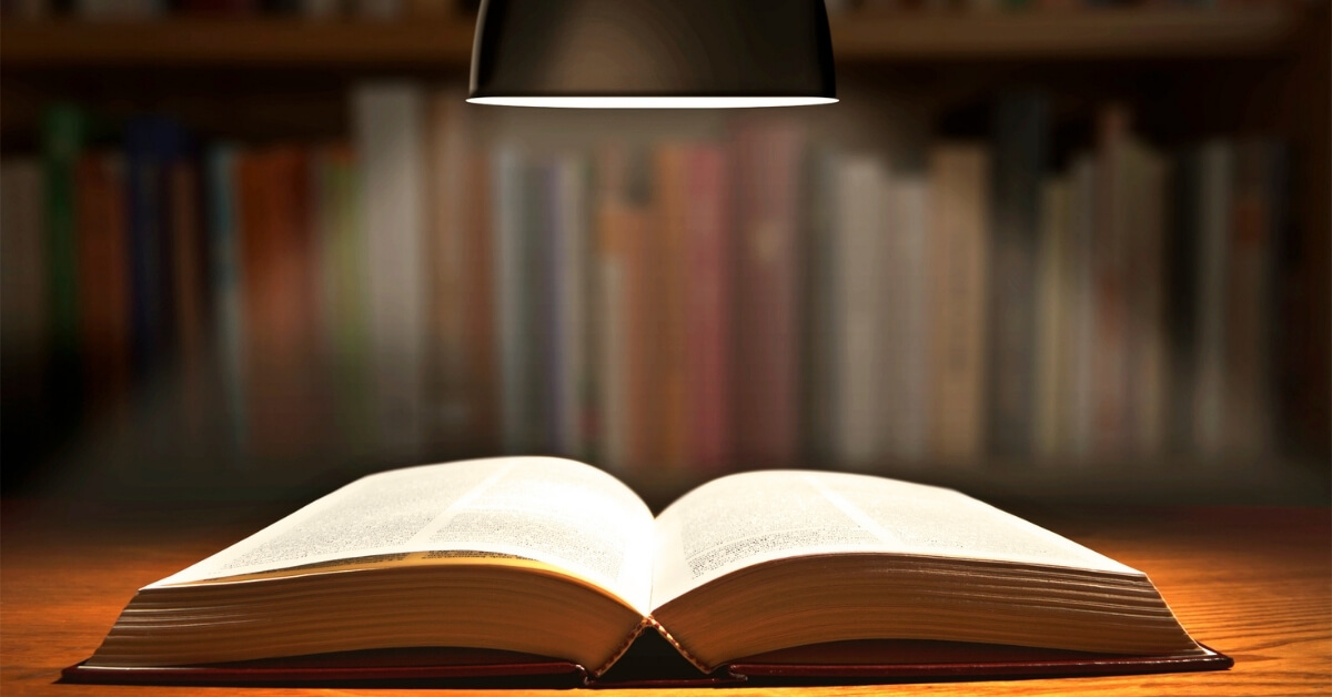a bible under a lamp