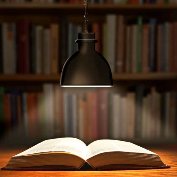 a bible under a lamp