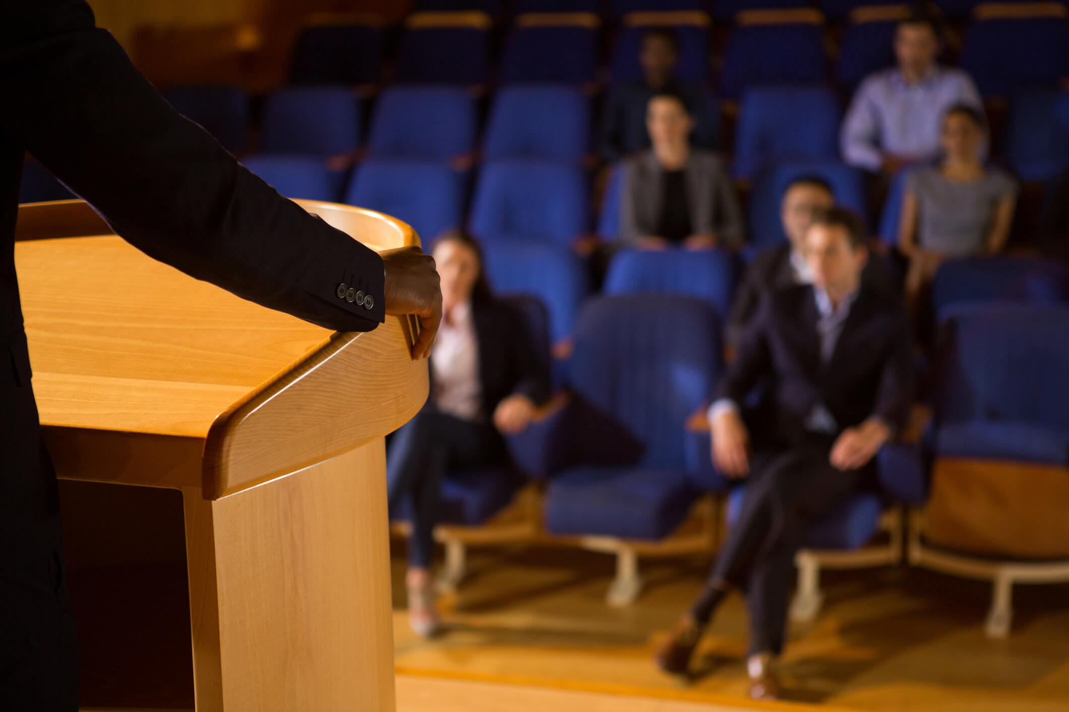 a pastor at a pulpit looking out over the congregation