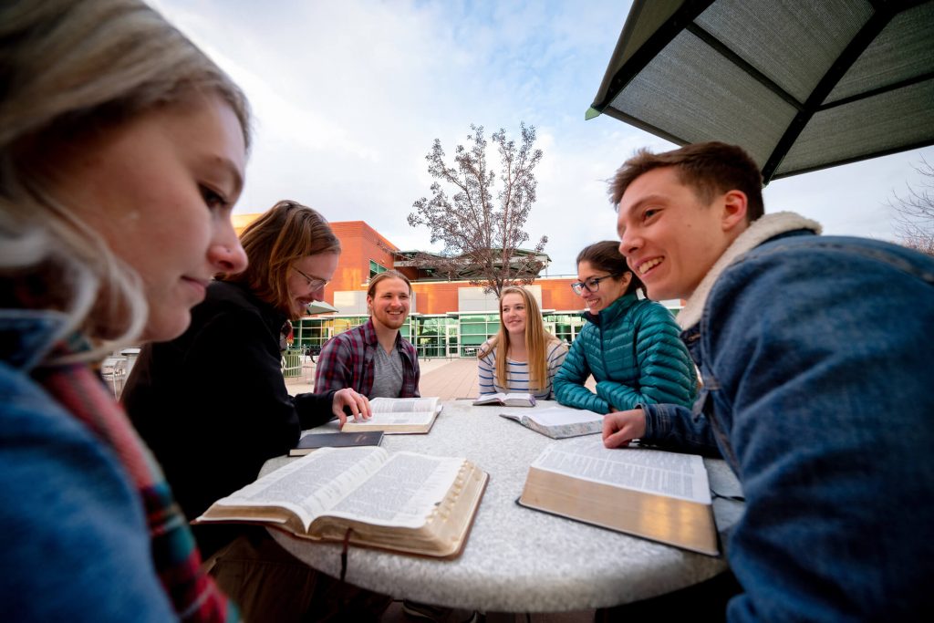 Group of young people having a Bible study