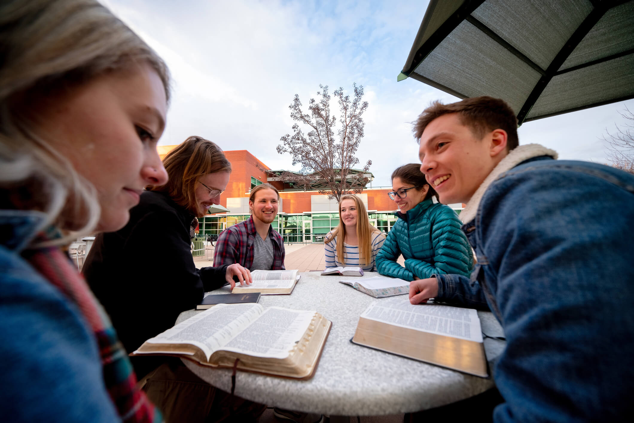 Group of young people having a Bible study