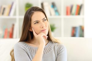 Thoughtful looking woman thinking about quitting porn