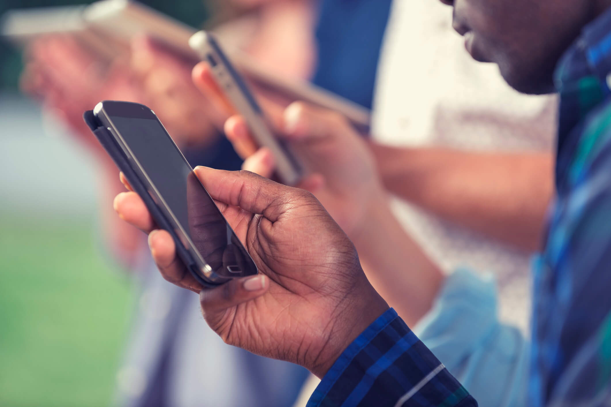 group of people using phones