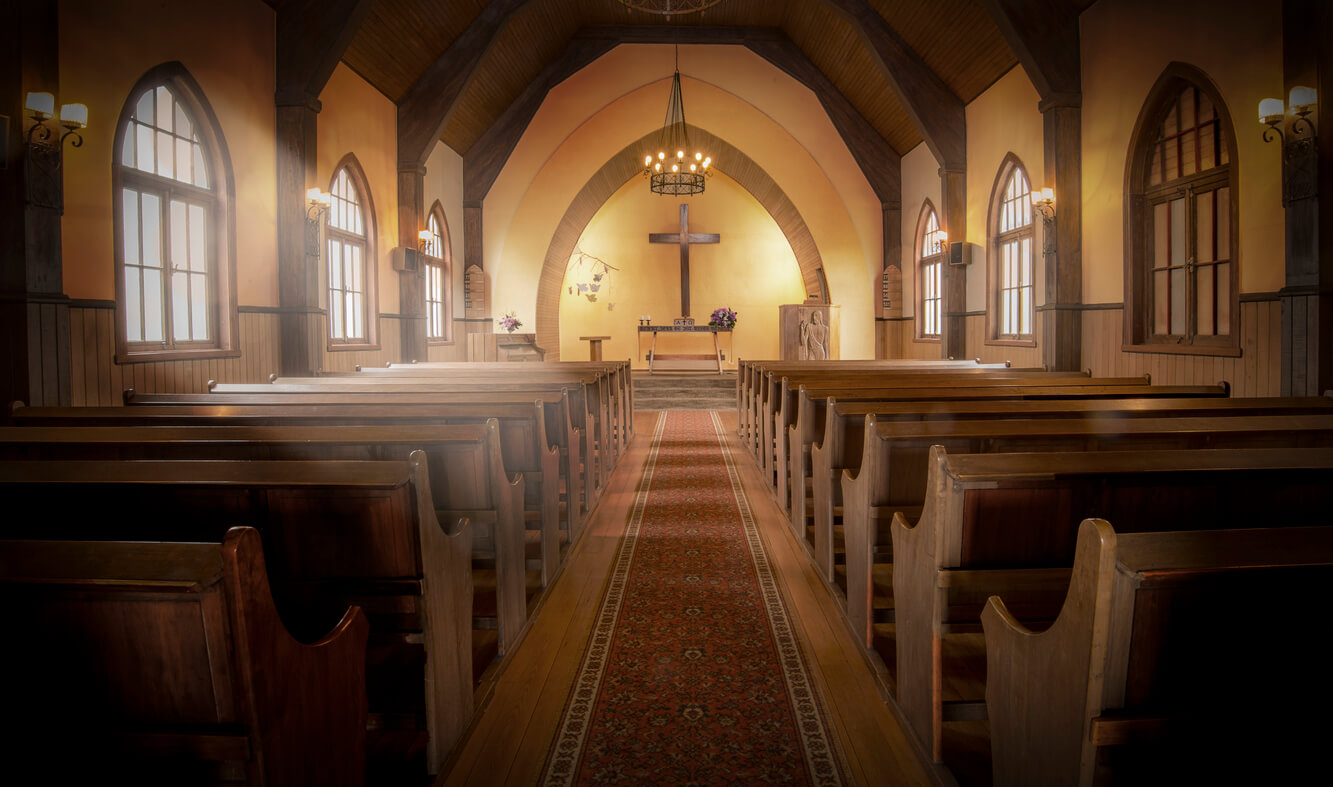Inside an empty church sanctuary.