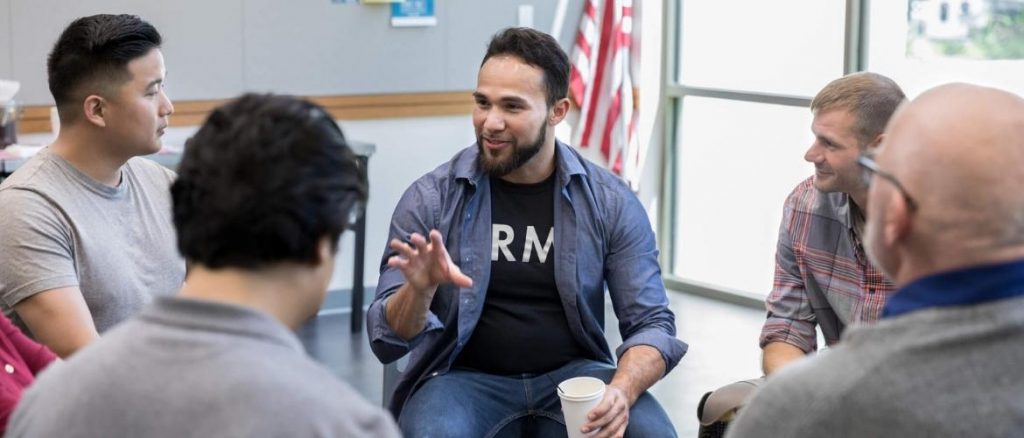 A group of men talking about porn addiction.