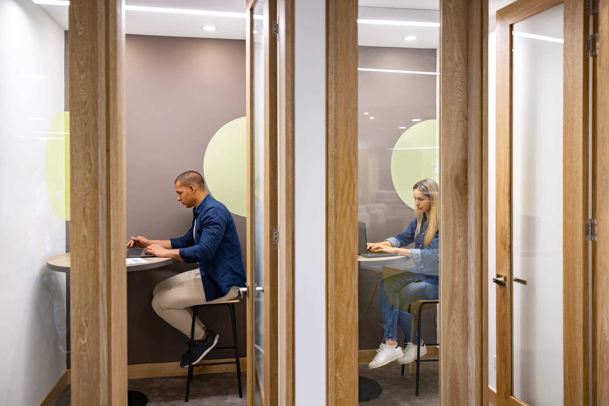 Office workers in cubicles.