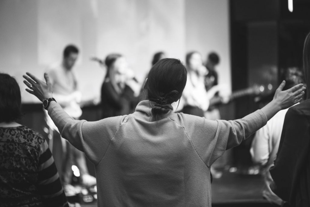 Black and white image of a worship service in a church.