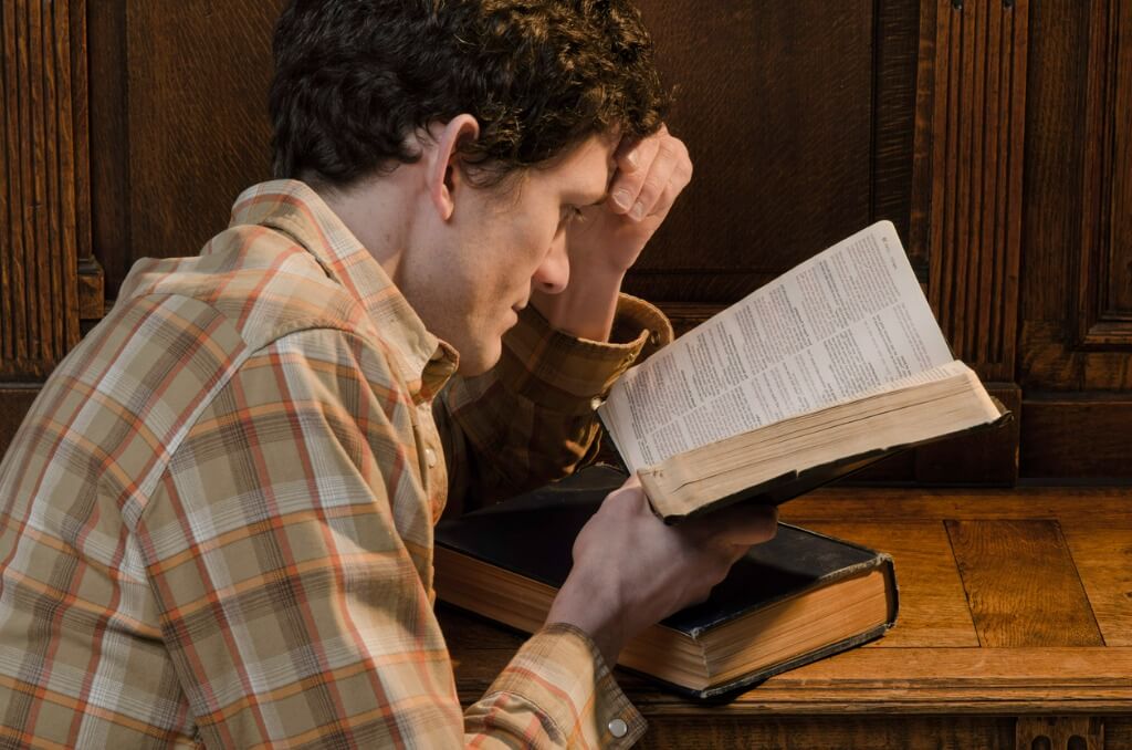 A young man studying Romans 6 and trying to understand his porn addiction.