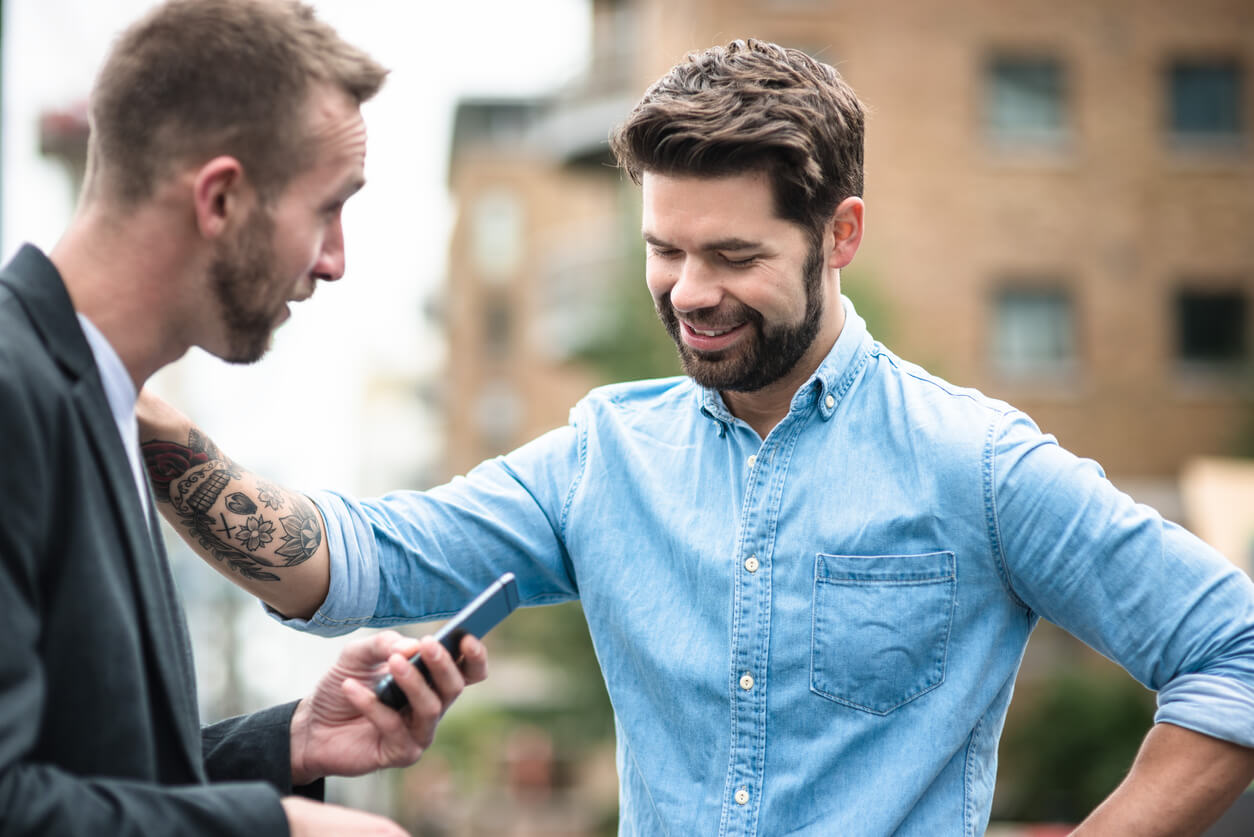 Two male accountability partners encouraging one another.