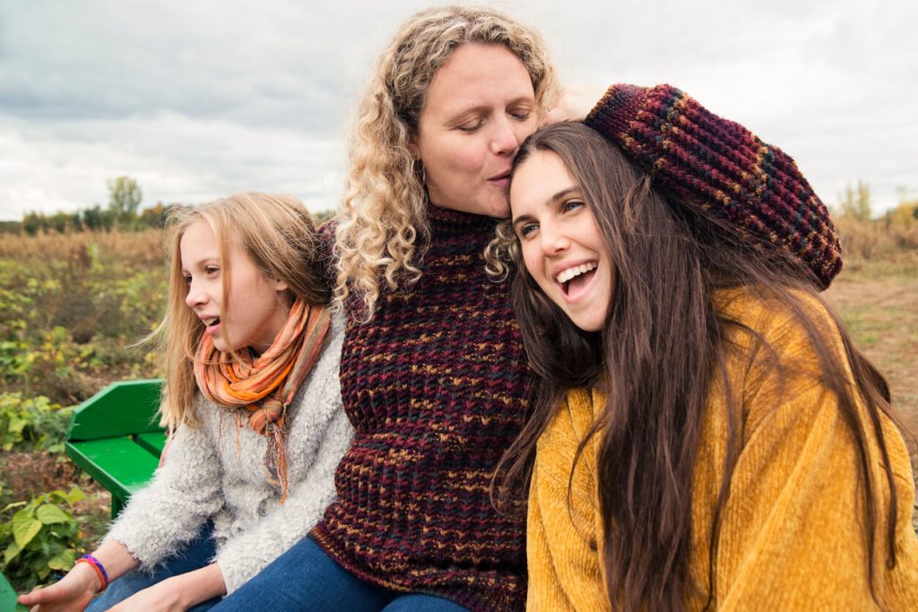 A mother with her teenage daughters.