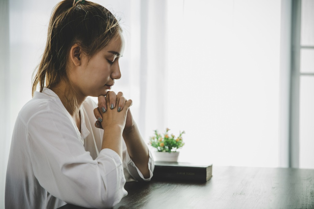 A woman asking forgiveness for watching bad things.