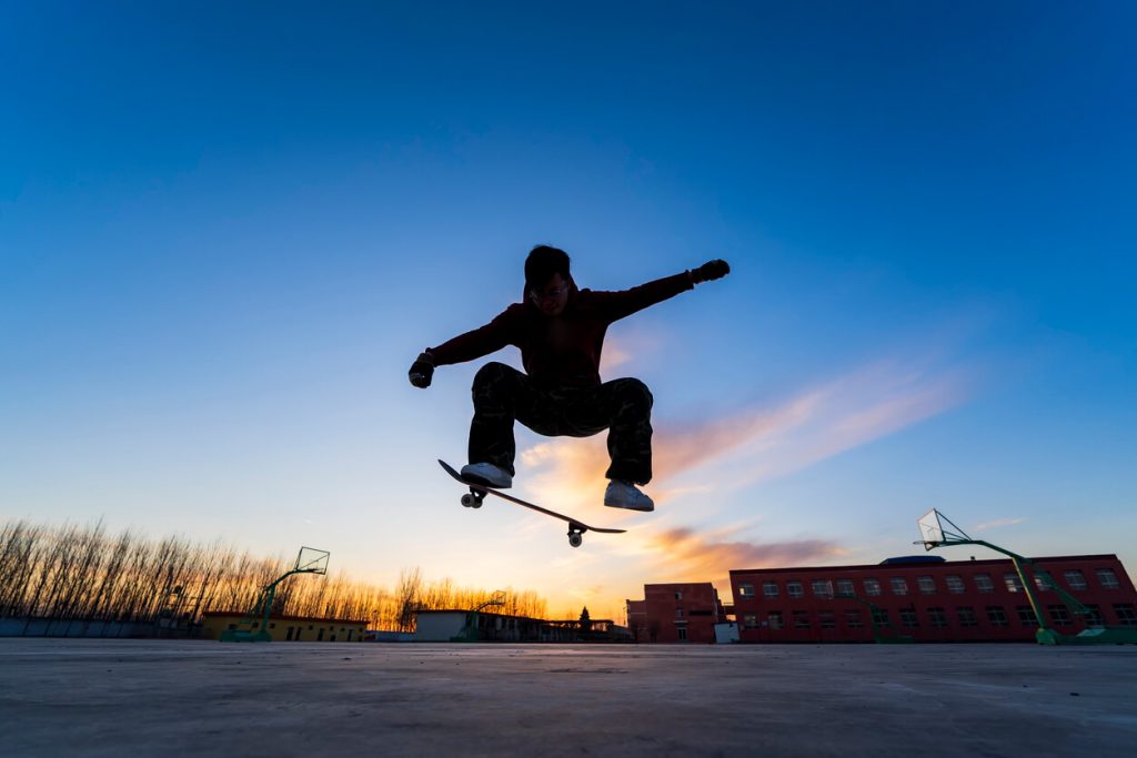 Silhouette of a skateboarder.