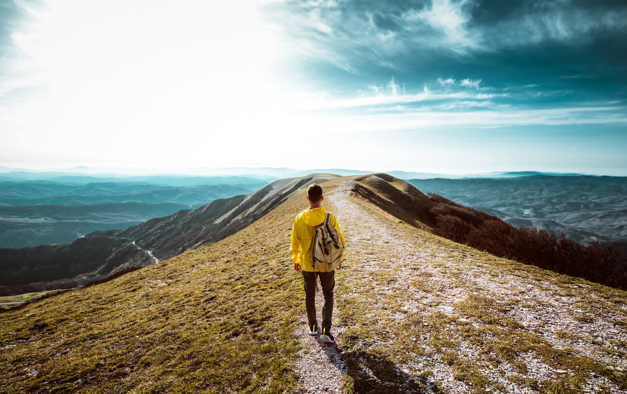 A solitary man on a scenic hike.