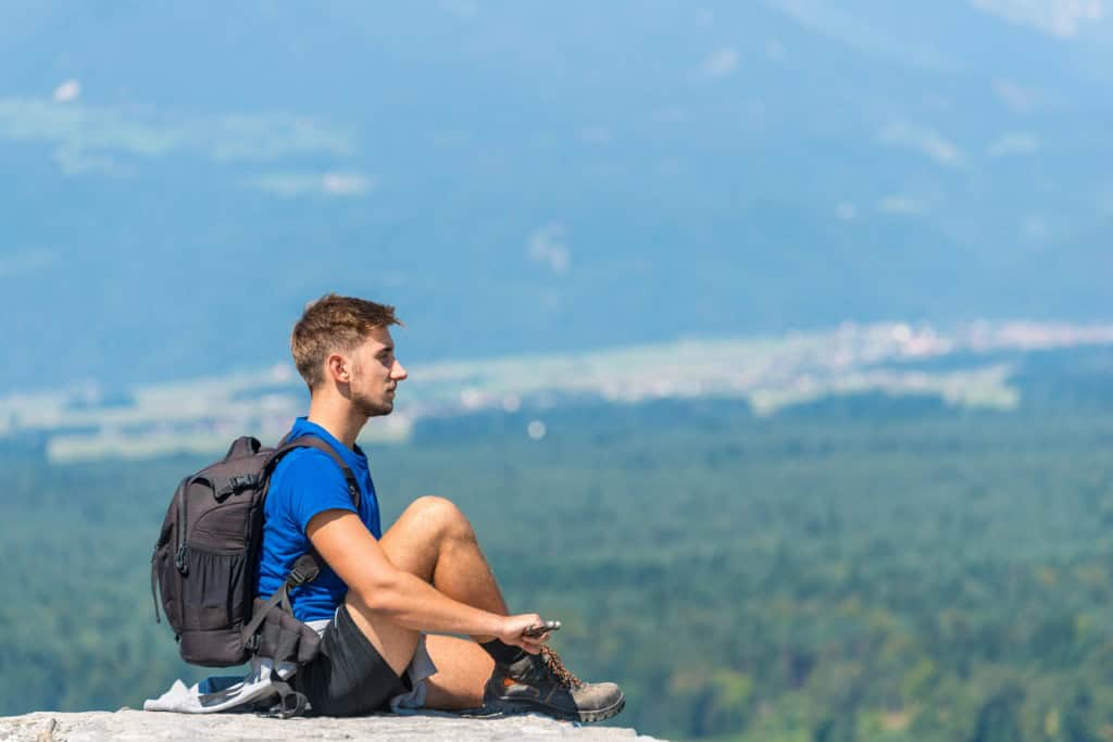 Young man taking a break while hiking.
